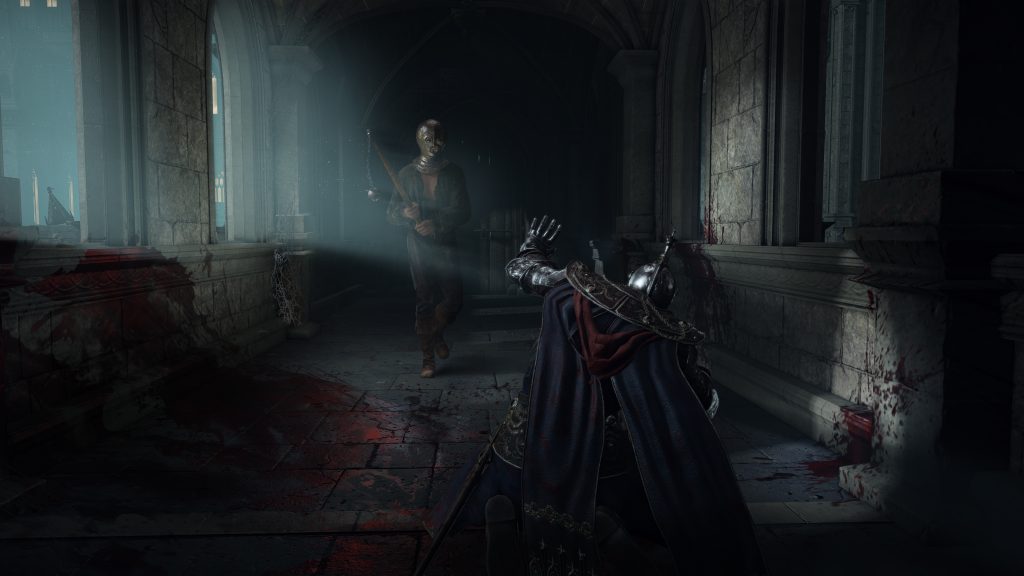 An armoured Tarnished confronts a masked enemy wielding a sword inside a dark, bloodstained castle corridor in Elden Ring.