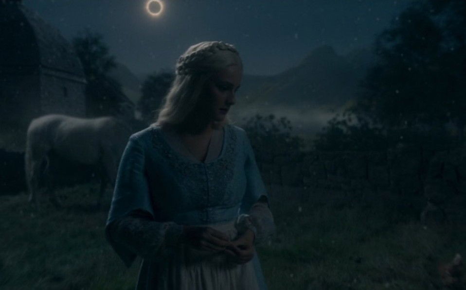 Helaena Targaryen stands beside a pale horse beneath an eclipse in House of the Dragon.