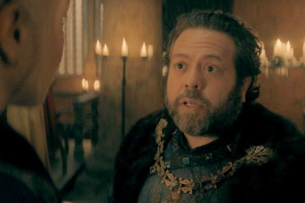 Torrhen Manderly speaks during a candlelit scene in House of the Dragon Season 3.
