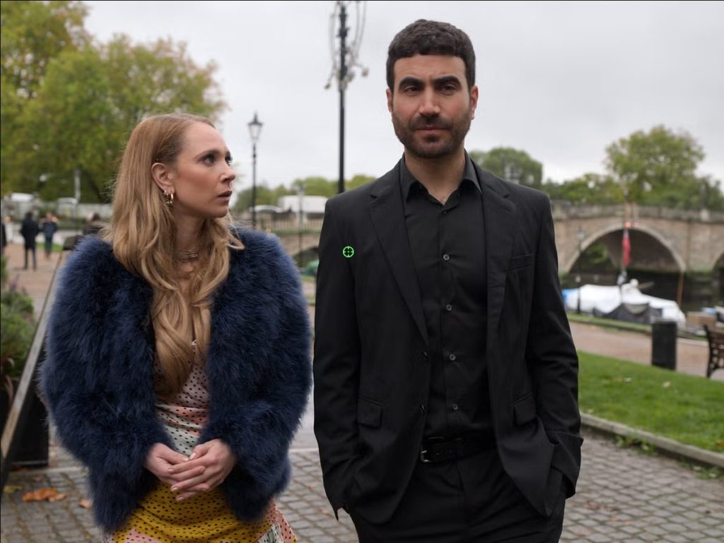 Roy Kent and Keeley Jones walk side by side along a riverside path during an emotional conversation in Ted Lasso.