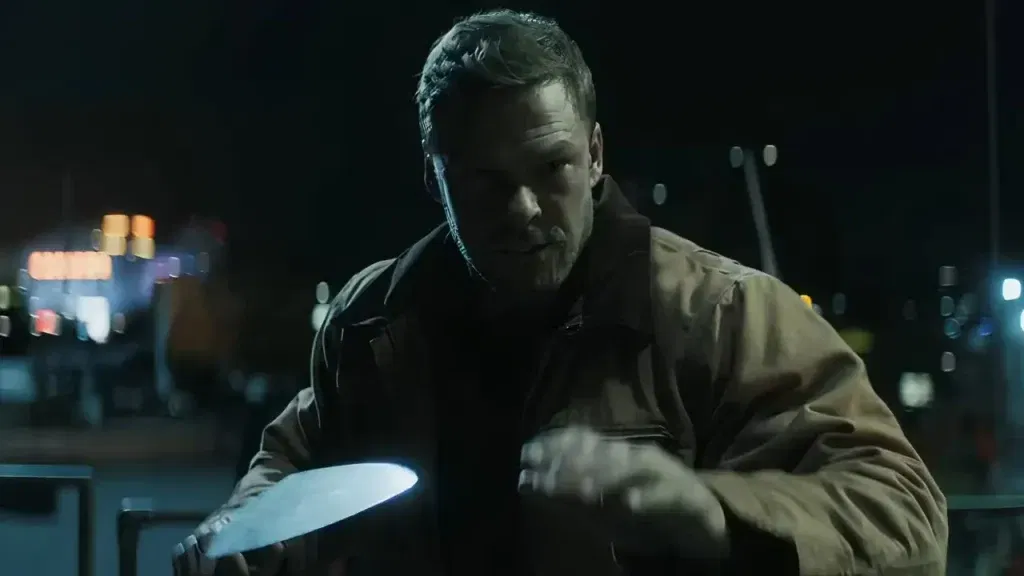 Alan Ritchson during the construction site fight in Reacher Season 2