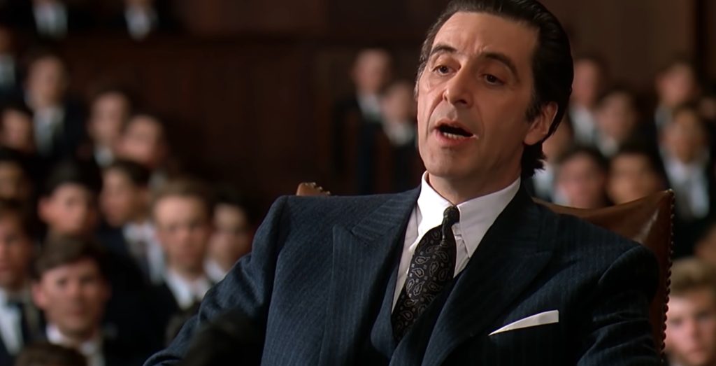 Al Pacino as Frank Slade sitting in a courtroom during the school disciplinary hearing in Scent of a Woman.