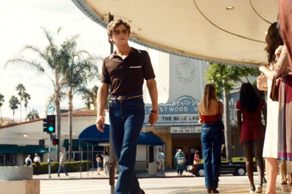 The Shards Episodes 3 & 4 Ending Explained: Are Matt and Rhonda Still Alive? 8 A young man wearing sunglasses and a dark polo shirt walks through a busy outdoor shopping area in The Shards.