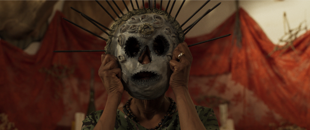 A person wearing a spike-covered mask in Parasomnia