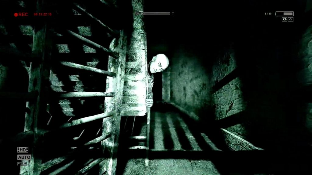 A gameplay screenshot of Outlast, a first-person survival horror game from the 2010s.