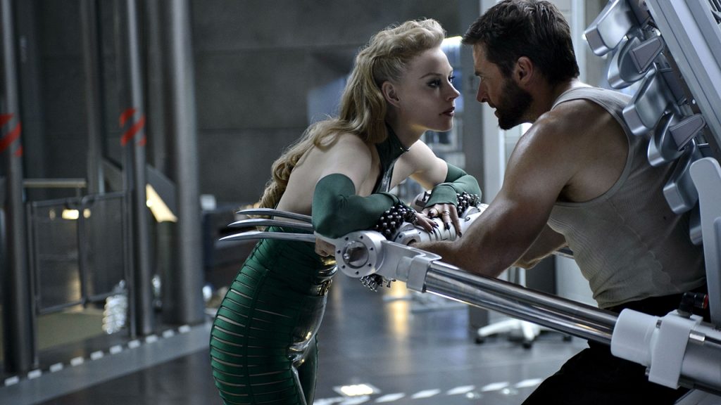 A scene from The Wolverine shows Viper, one of the movie's antagonists, leaning in close to Hugh Jackman's Logan, who is restrained.