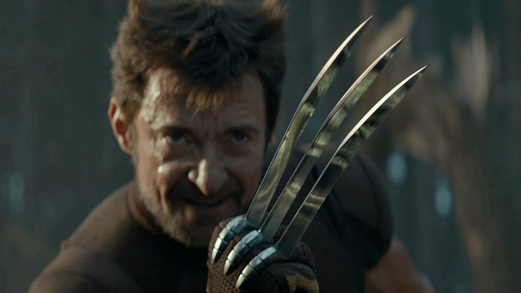 A scene from Deadpool & Wolverine, featuring The Hulk's enraged face appearing in a reflection on Wolverine's adamantium claws.