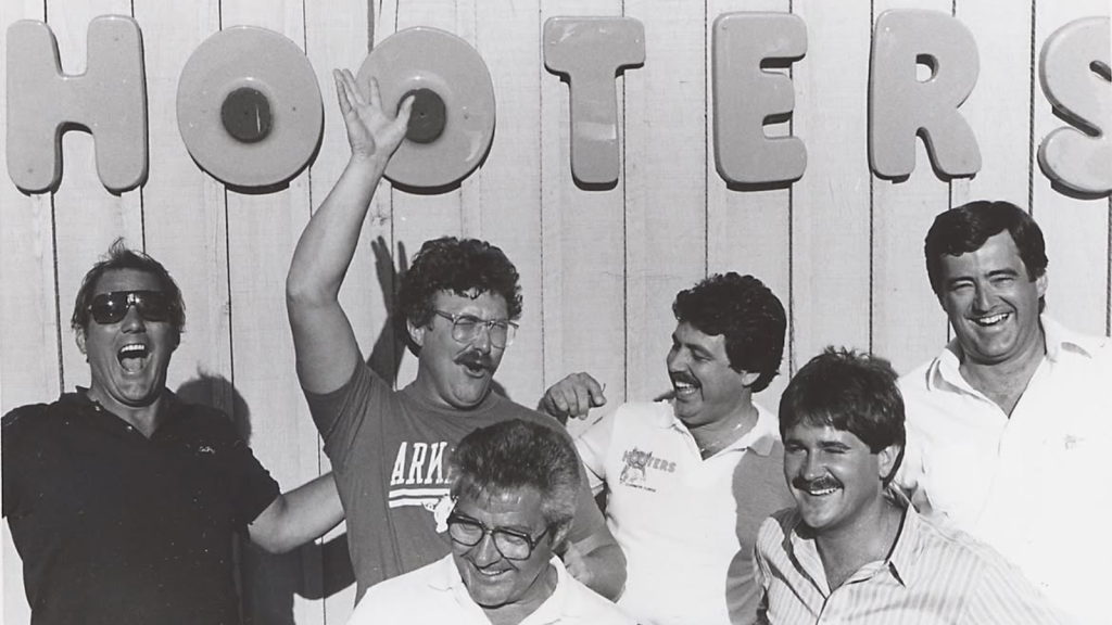'Hooters' Origin Movie in the Works: Everything We Know 1 The original "Hooters Six," the group of businessmen who founded the Hooters restaurant.