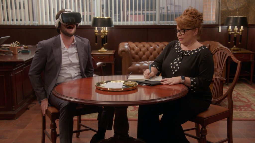 The Varnell Hill Show Season 1 Review: A Decent Return to Sitcoms for Davidson 7 (L-R): Nicholas Cafero as Jonah and Monica Lee Gradischek as Executive Wendy in episode 1, season 1, of The Varnell Hill Show, streaming on Paramount+ 2026. Photo credit: Paramount+