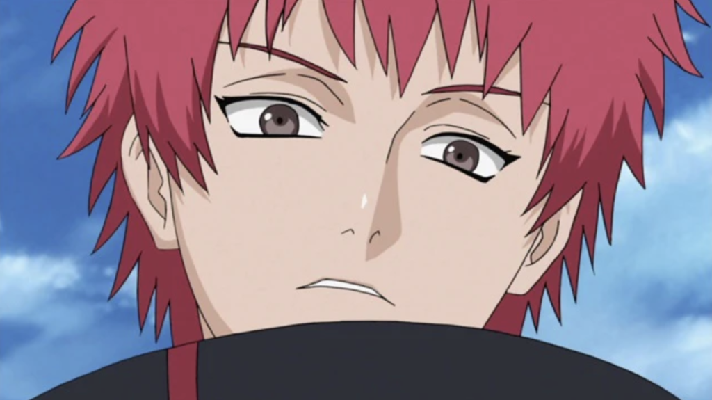 The character shown in the image is Sasori (also known as Sasori of the Red Sand), a powerful master of puppetry and a former member of the criminal organization Akatsuki from the anime and manga series Naruto / Naruto Shippuden.