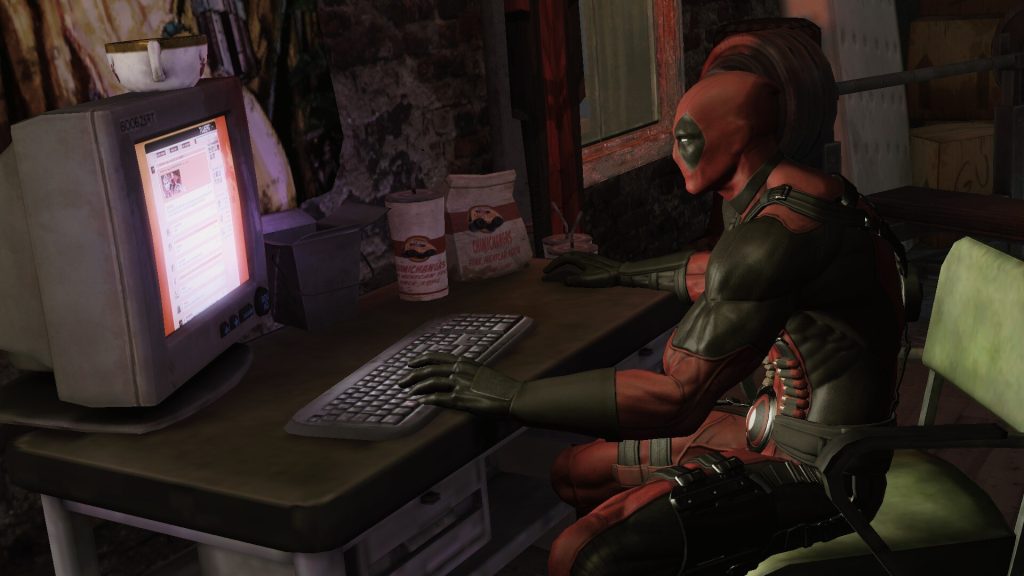2013 Deadpool game screenshot showing the titular protagonist sitting at his desktop computer browsing the internet.
