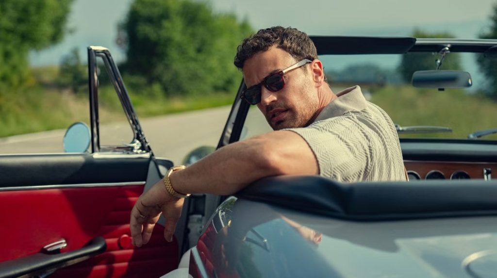 Theo James as Eddie Horniman driving a vintage convertible car in The Gentlemen Season 2