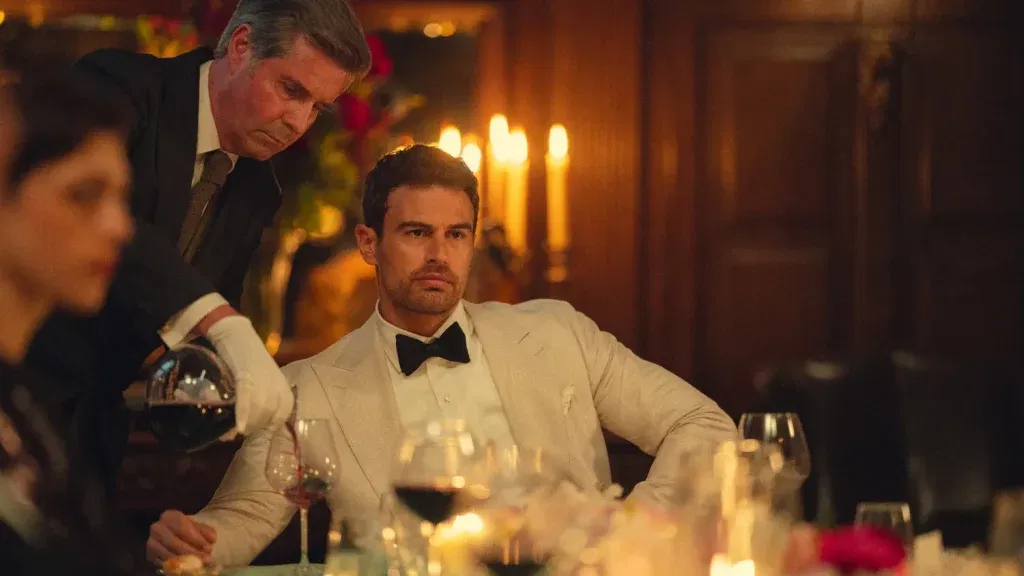 Eddie drinks a glass of wine