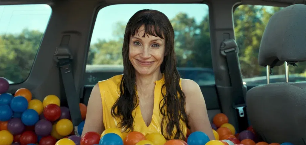 Jessica Chastain smiling creepily in a still from Other Mommy.